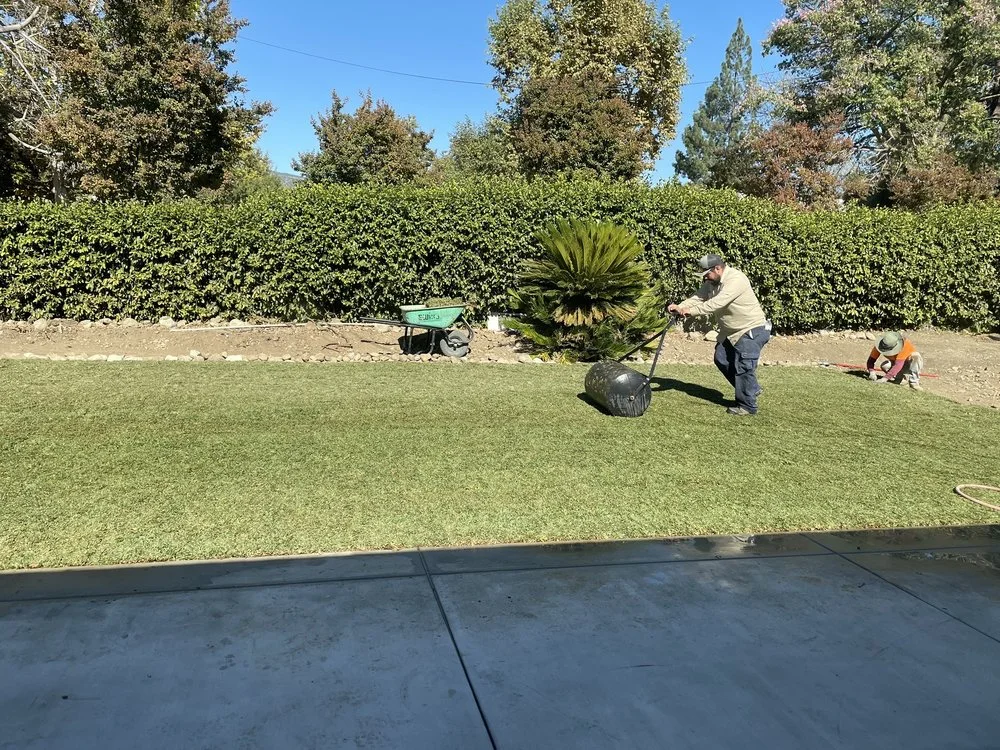 Crew member tending a lawn in Aran’s published project portfolio